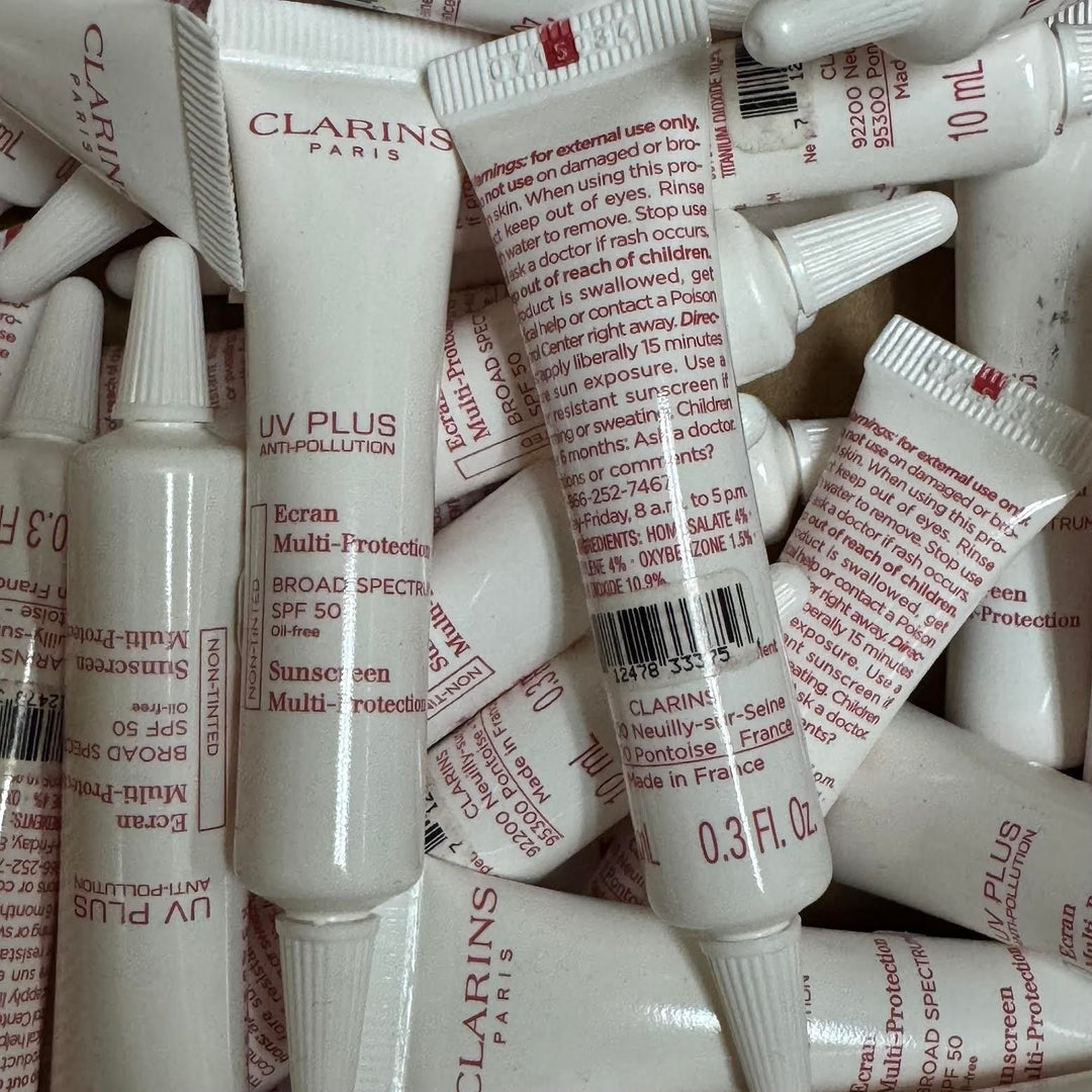 100 PIECE LOT - CLARINS UV PLUS ANTI-POLLUTION SUNSCREEN MULTI-PROTECTION NON-TINTED 0.3 OZ