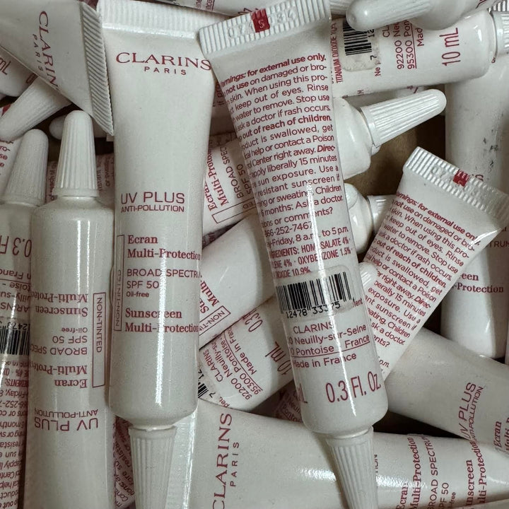 100 PIECE LOT - CLARINS UV PLUS ANTI-POLLUTION SUNSCREEN MULTI-PROTECTION NON-TINTED 0.3 OZ